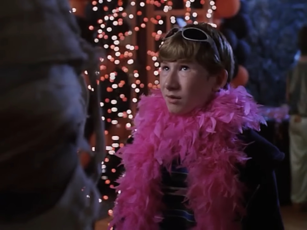Gilbert in a feather boa at the Halloween dance
